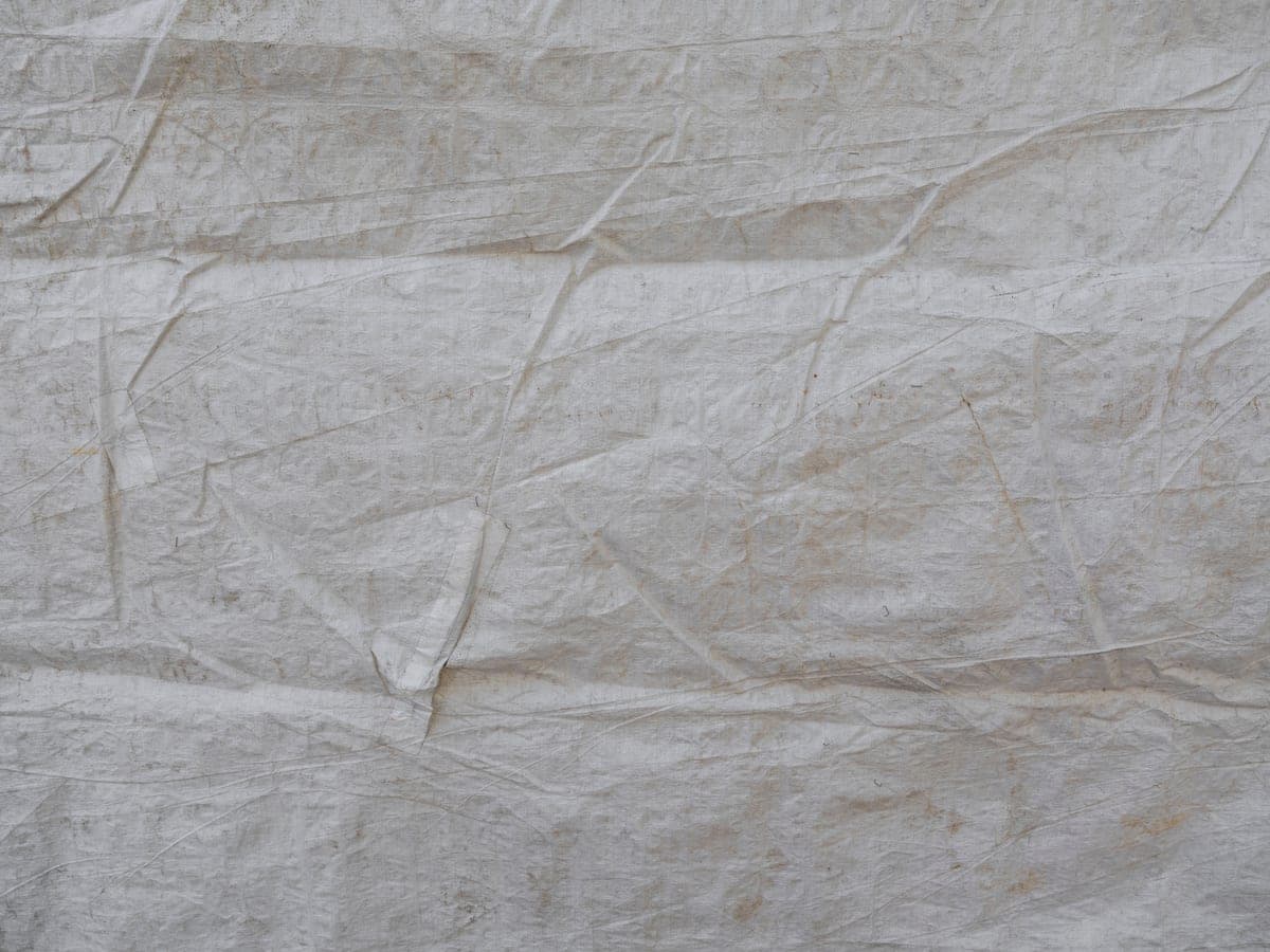 A jacket laid flat with its lining exposed, showing the panel positions across the chest and back.