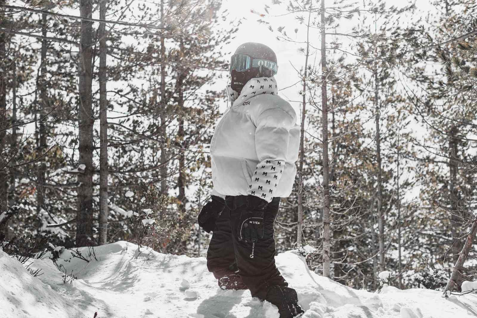 Person in winter gear standing in a snowy forest in Brezovica, Serbia.